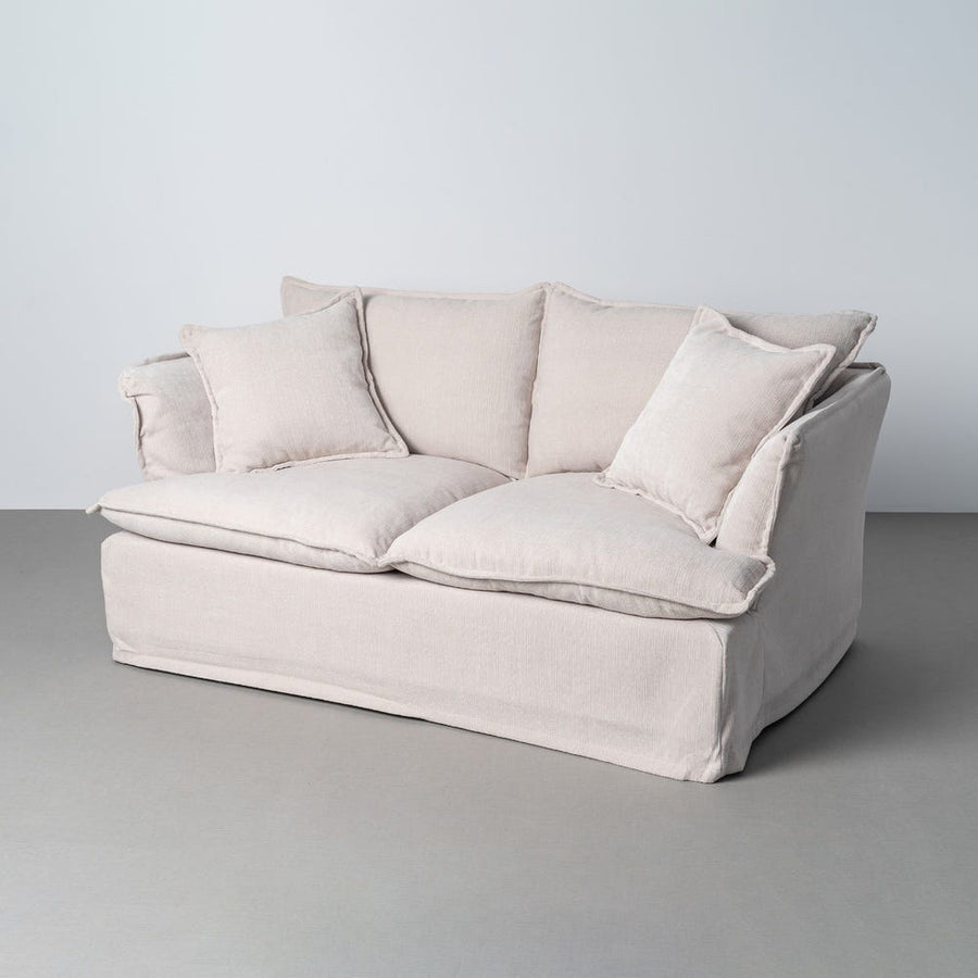 Canapé deux places en tissu polyester aux housses amovibles, couleur crème