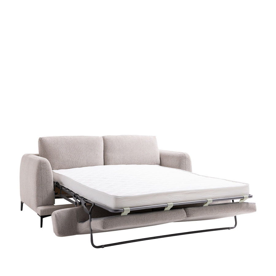Canapé convertible aux lignes arrondies sur quatre pieds en métal noir, couleur beige, vue 2